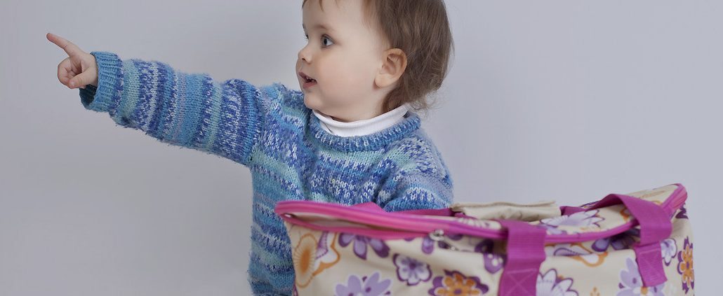 The baby playing with bag